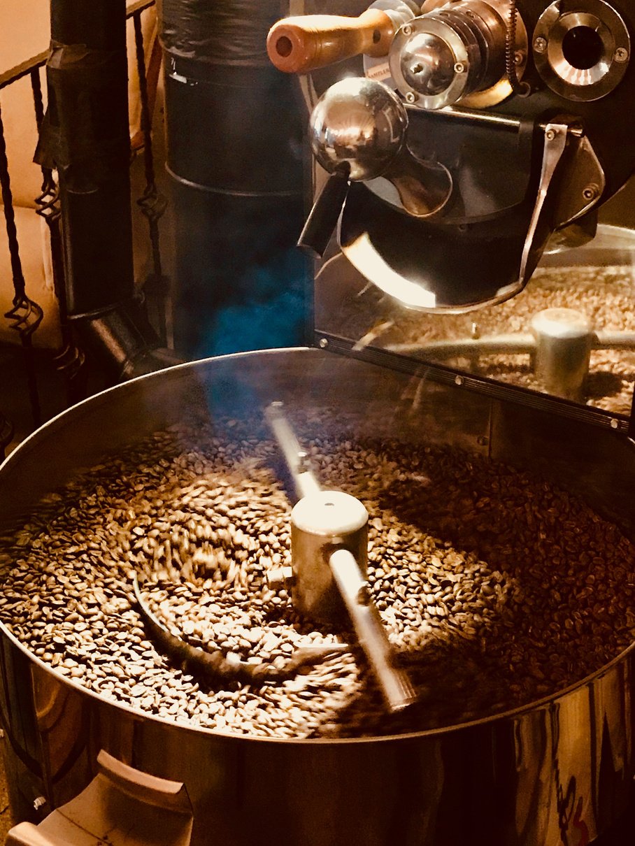 Freshly Roasted Aromatic Coffee Beans in a Coffee Roasting Machine.